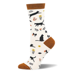 Cream bamboo sock with rust cuff, heel, and toe. Pattern shows black cat silhouettes, yellow flowers, and orange mushrooms.