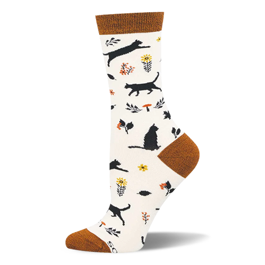 Cream bamboo sock with rust cuff, heel, and toe. Pattern shows black cat silhouettes, yellow flowers, and orange mushrooms.
