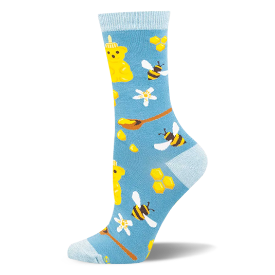 Light blue bamboo socks with a pattern of yellow honey bear bottles, flying bees, honeycombs, and wooden spoons.