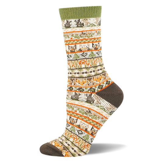 Off-white crew sock with an earthy sweater pattern showing bands of pixelated bears, foxes, owls, and green pine trees.