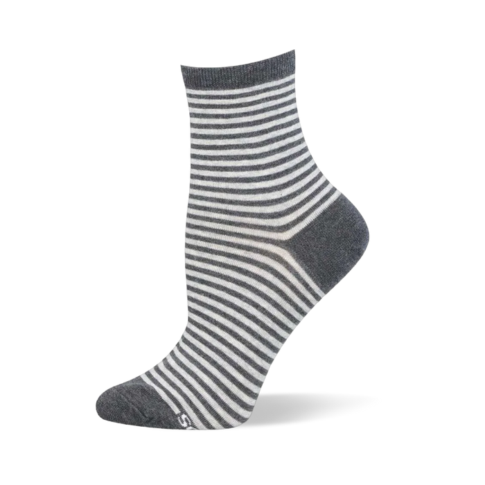 Grey and white striped ankle sock on a mannequin showing a solid grey top band alongside a matching heel and toe.