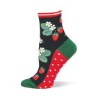 Black sock showing red strawberries, green leaves, and white flowers. Green heel and toe, red and white polka dot sole.