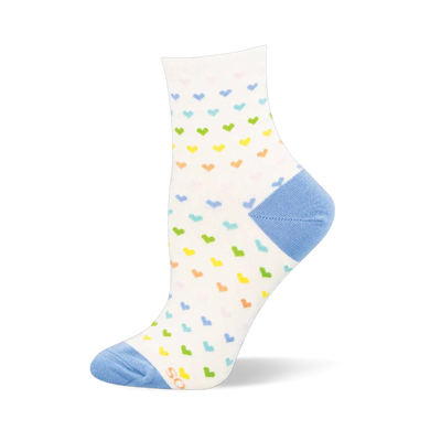 White sock featuring a repeating pattern of tiny pastel-colored hearts with a contrasting light blue heel and toe.
