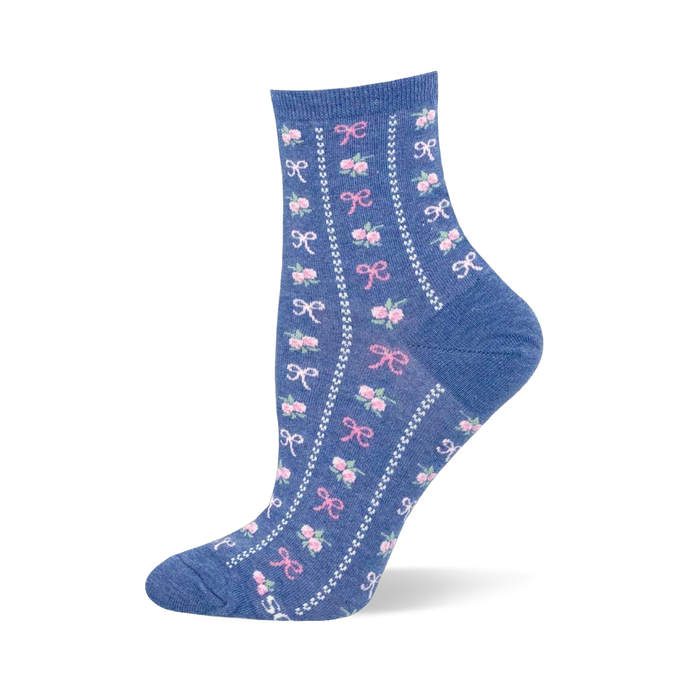 Heather blue crew sock featuring vertical white dotted lines separating columns of small pink bows and floral bouquets.