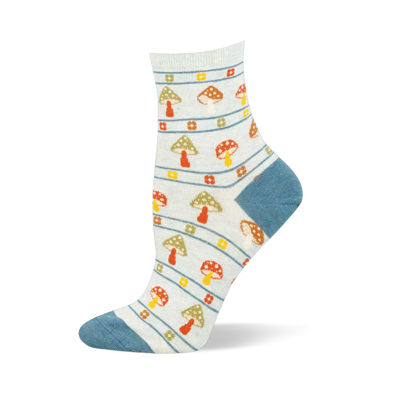 Light blue crew sock with dusty blue heel and toe. Features horizontal stripes, floral squares, and speckled mushrooms.