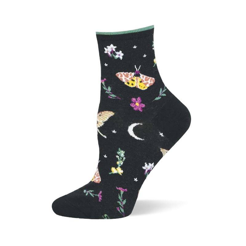 Black ankle sock featuring a pattern of colorful moths, purple and white flowers, a white crescent moon, and tiny stars.