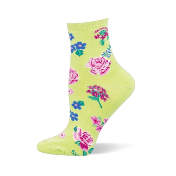Light green sock with a cottage garden pattern showing pink roses, small blue flowers, magenta clusters, and green leaves.