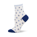 Cream sock with thin light blue stripes and a pattern of small dark and light blue anchors. Navy blue heel and toe sections.
