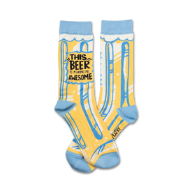 yellow socks with blue toe, heel, and cuff. "kathy" printed on left cuff. "this beer is making me awesome" on front. crew length. for men and women. 