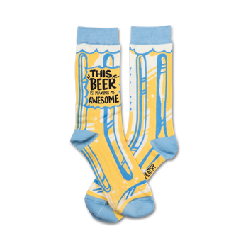 yellow socks with blue toe, heel, and cuff. "kathy" printed on left cuff. "this beer is making me awesome" on front. crew length. for men and women. 