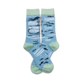 A pair of crew socks in light blue and mint green. The design features a cartoon mermaid with the text 'Kinda Pissed About Not Being a Mermaid' and small fish.