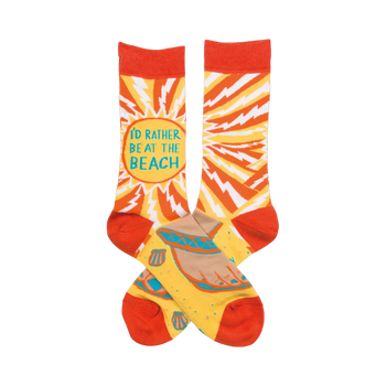 Crew socks in orange and yellow.  One features 'I'd rather be at the beach' surrounded by a lightning bolt pattern. The other shows a beach scene with seashells.