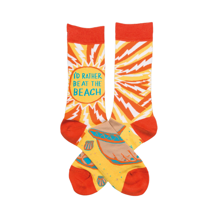 Crew socks in orange and yellow.  One features 'I'd rather be at the beach' surrounded by a lightning bolt pattern. The other shows a beach scene with seashells. }}