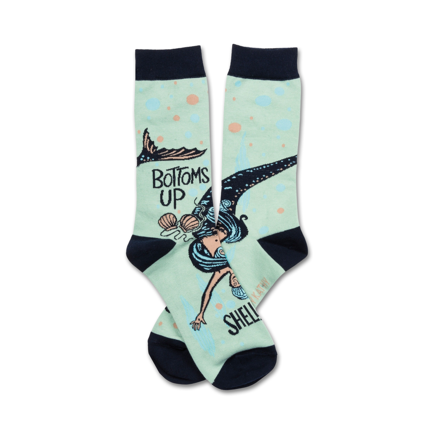 A pair of mint green crew socks featuring a whimsical illustration of a mermaid swimming upside down with seashells. The socks also say 'Bottoms Up'.