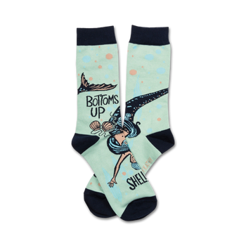 mint green crew socks with navy blue toe, heel, and top for women, featuring a mermaid diving towards 'shell' with a seashell bra. text reads 'bottoms up...shells off'.  