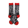 A pair of black crew socks with a red cuff.  The design features a white cartoonish figure, geometric shapes, and the text 'I'm not anti-social'.