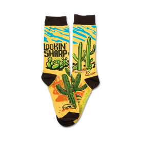 whimsical crew socks featuring cacti, skulls, and a snake on a desert scene background with "lookin' sharp" text.   