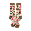 Pair of cream crew socks with a whimsical floral pattern in shades of pink and brown. The socks also feature a quote.