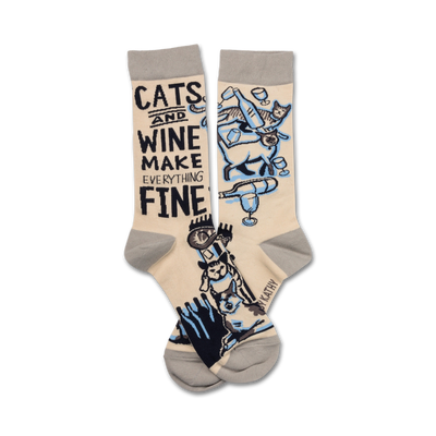 crew length women's socks in pink featuring cats, wine glasses, and the text "cats and wine make everything fine."   