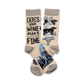 Cream crew socks with a fun design of black dogs, wine bottles, and glasses. Text reads, 'Dogs and Wine Make Everything Fine'.