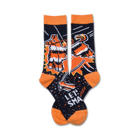 black crew socks with orange toe, heel, and cuff feature cartoon piã±ata being hit with a stick. let's smash text above the piã±ata.   