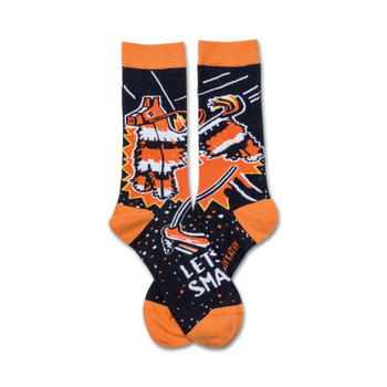 black crew socks with orange toe, heel, and cuff feature cartoon piã±ata being hit with a stick. let's smash text above the piã±ata.   