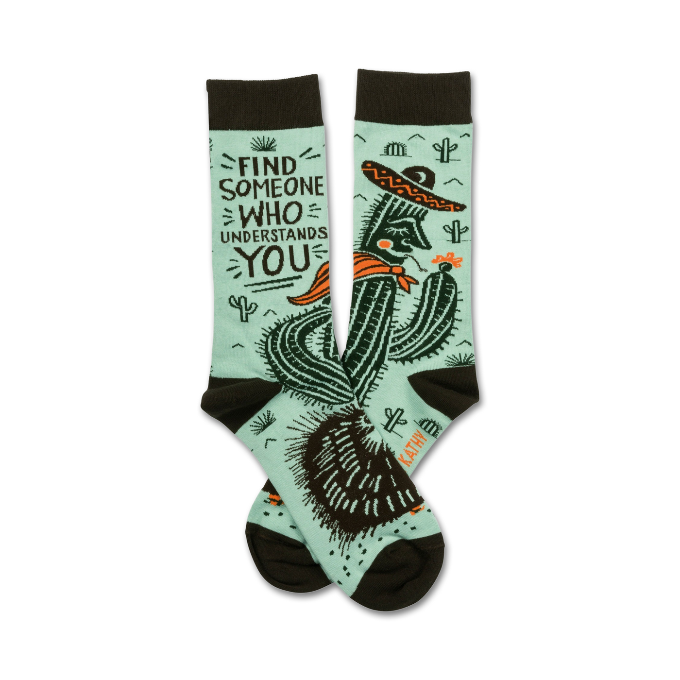 Pair of teal crew socks with a dark brown cuff.  Features a graphic of a cactus wearing a sombrero and the text 'Find someone who understands you'.