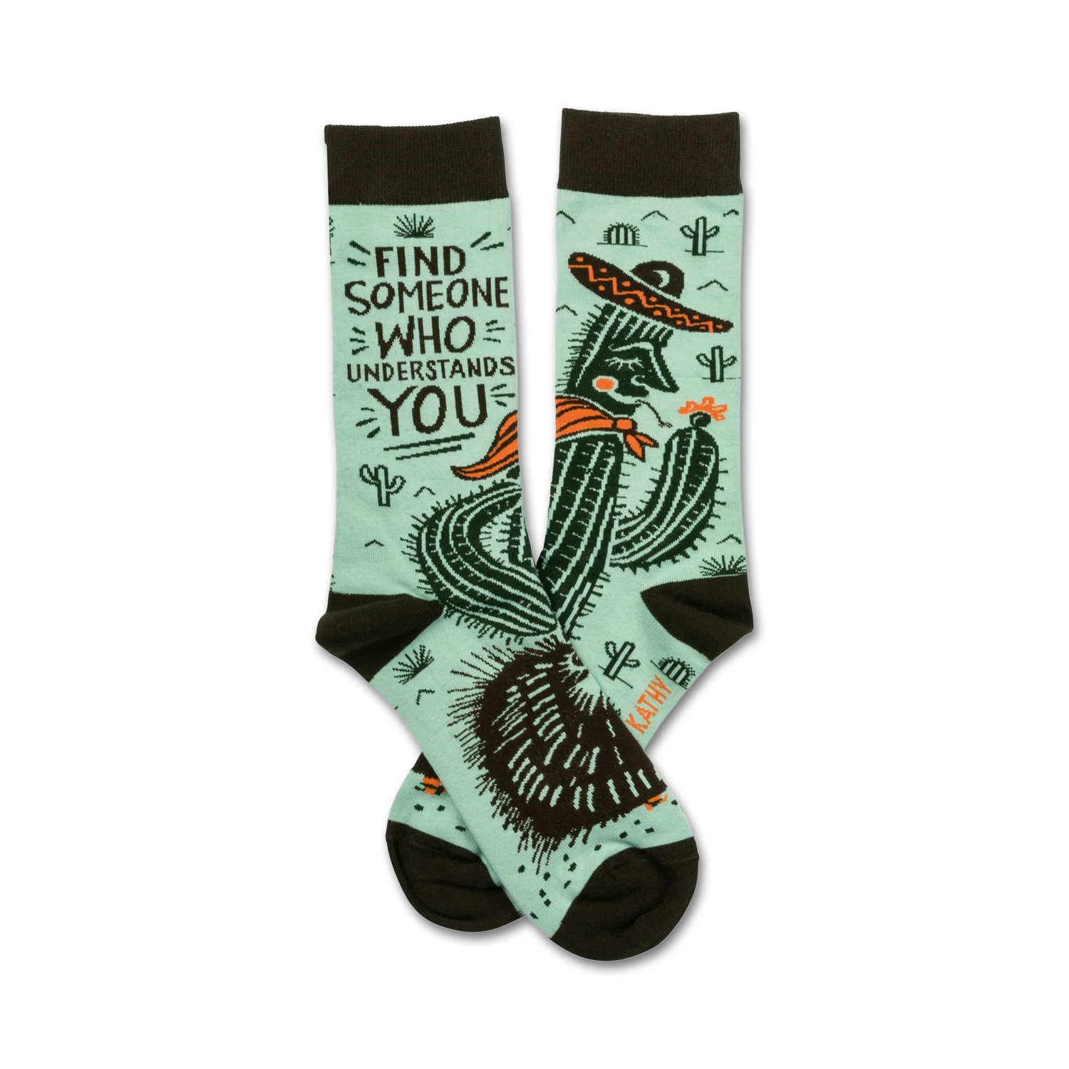 Pair of teal crew socks with a dark brown cuff.  Features a graphic of a cactus wearing a sombrero and the text 'Find someone who understands you'.