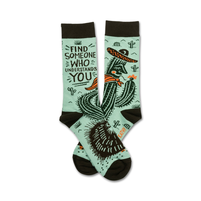 mint green socks with brown toes and heels feature a relaxed cactus in a sombrero smokin' a cigarette surrounded by prickly pears. words state 