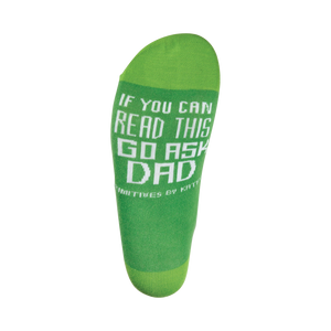 A green sock with white lettering that reads: 