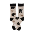 A pair of beige crew socks with a playful design featuring black bears, paw prints, and mountain outlines. The cuffs are black.