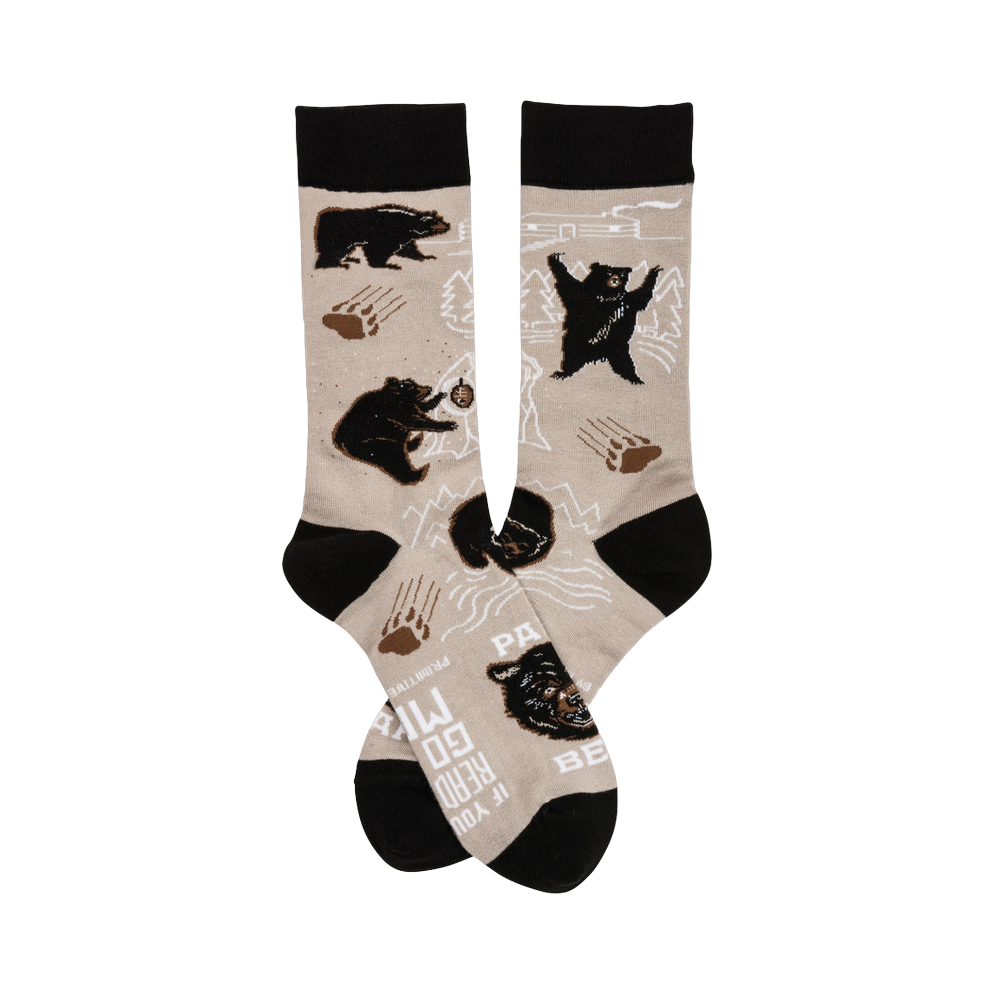 A pair of beige crew socks with a playful design featuring black bears, paw prints, and mountain outlines. The cuffs are black.