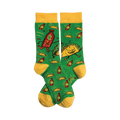 Crew socks in green with yellow cuffs. The design shows cartoon tacos and hot sauce bottles dancing on a green background.
