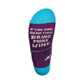 Close-up of the sock's heel, showing the text 'If you can read this, bring more wine' in a pixel font.