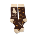 Brown crew socks with a cream cuff.  The socks feature a repeating pattern of mustard-yellow dogs and the text, 'I like big mutts and I cannot lie'.
