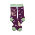 Pair of purple crew socks with light green cuffs.  Features a repeating pattern of pale yellow and lilac dog silhouettes and text: 'I cannot live without my dog'.