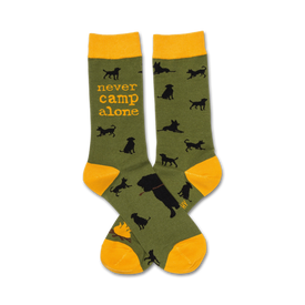 dark green/black dog silhouette crew sock with yellow cuff, which features text " never camp alone".  