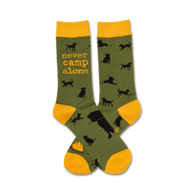 dark green/black dog silhouette crew sock with yellow cuff, which features text " never camp alone".  