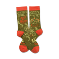 Crew socks in olive green and coral.  The socks feature a design of flowers, plants, and the phrase 'Just Be Happy Today'.