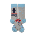 A pair of grey crew socks with light blue cuffs. The socks feature an upward arrow, the words 'Awesome Nurse', red poppies, and a beaker graphic.