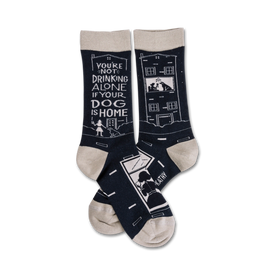 black crew socks featuring "you're not drinking alone if your dog is home" text and a dog illustration.   