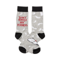 A pair of grey crew socks with a white feather pattern and 'Don't Ruffle My Feathers' in red lettering. The socks also feature a small bird graphic.
