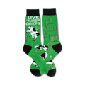 Pair of green crew socks with black toes and cuffs. Design features a farmyard scene with cows escaping, a barn, and the text 'Live like someone left the gate open'.