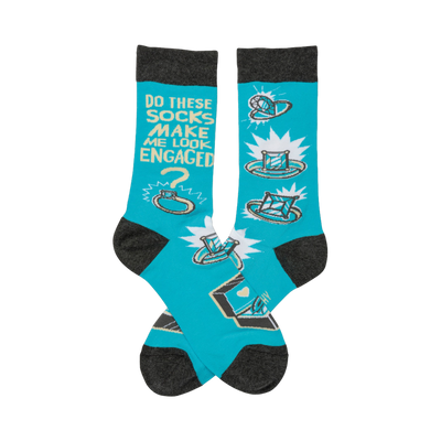 Crew socks in turquoise with gray cuffs.  The design features cartoon rings, diamonds, and the text 'Do these socks make me look engaged?'