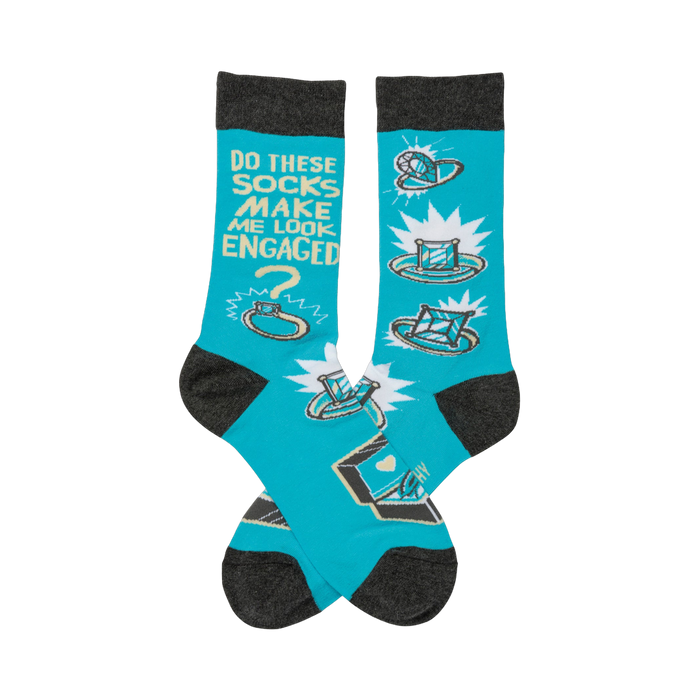 Crew socks in turquoise with gray cuffs.  The design features cartoon rings, diamonds, and the text 'Do these socks make me look engaged?' }}