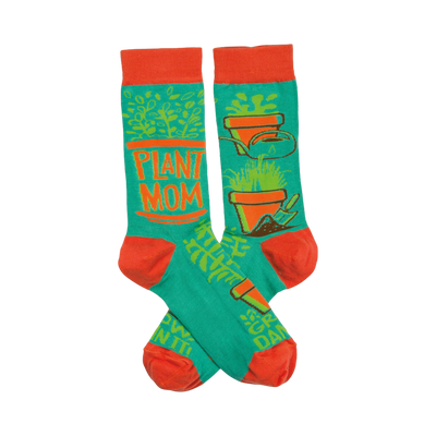 Crew socks in teal and orange.  The design includes potted plants, gardening tools, and the words 'Plant Mom'.