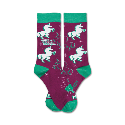  purple crew socks with green accents feature white unicorns prancing under the stars. "who's a special unicorn? me!"  