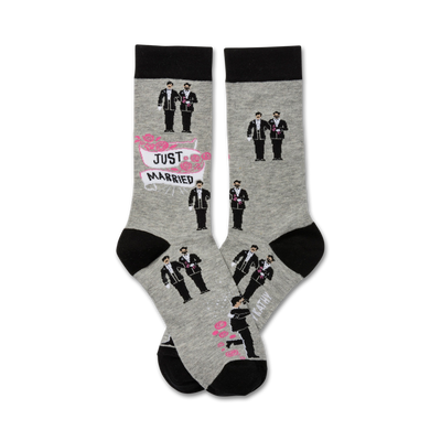 mens crew socks in gray with black toe, heel, and cuff. pattern of two grooms in black suits holding hands. 'just married' banner and 'two grooms' printed on sole.  