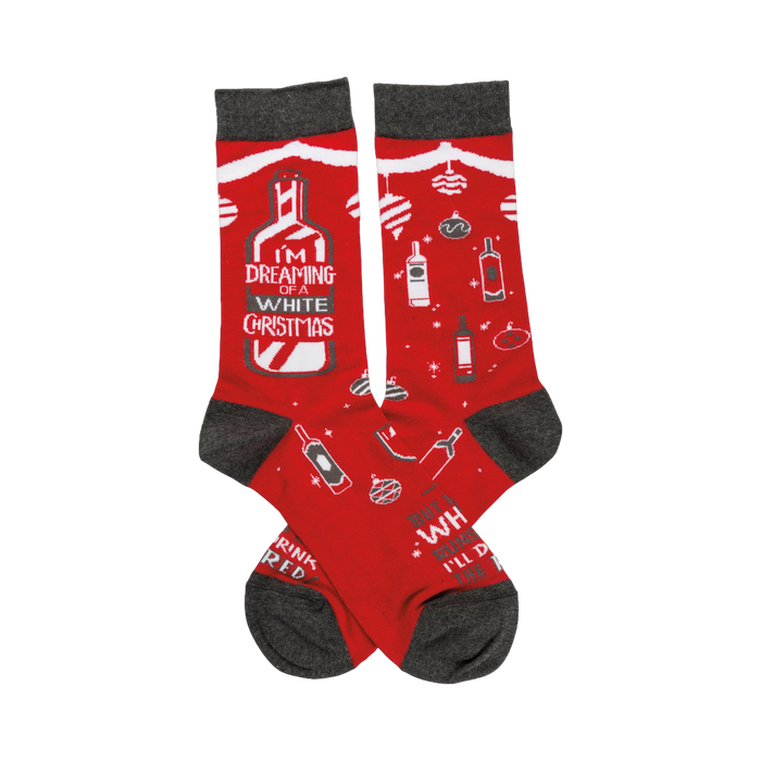 Crew socks in red with gray cuffs.  Design features white wine bottles, ornaments, and the text 'I'm dreaming of a White Christmas'. }}