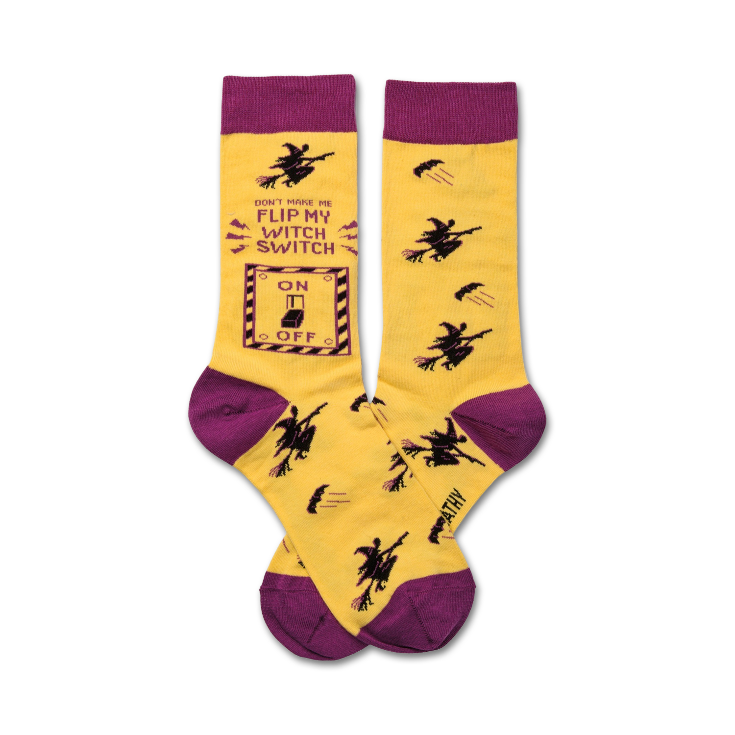 Crew socks in yellow and purple. One sock features a graphic of a light switch with 'Don't make me flip my witch switch' text and flying witch illustrations.